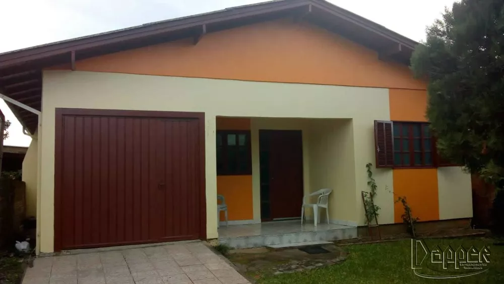 Casa à venda com 3 quartos, 100m² - Foto 1